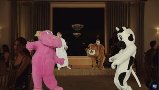 Back in the fancy restaurant, Ed is on stage in his bathrobe, Beebs is still rockin' the bear suit, the pink hippo is there, and now there's a cow mascot.