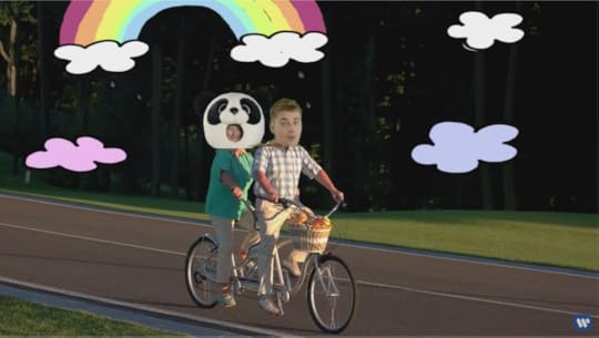 Justin and Sad Panda Ed's heads are superimposed over the heads of a senior citizen couple riding a tandem bicycle.
