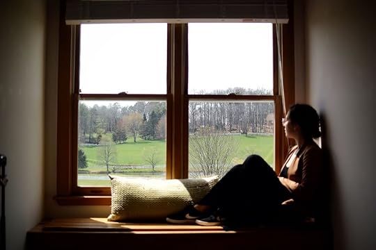 Person looking out of window at Horse Shoe Farm
