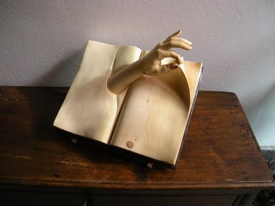 Carved wooden book sculpture by Nino Orlandi