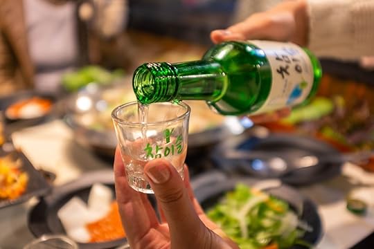 Soju being poured into a glass