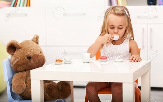 little girl having tea party with stuffed animals