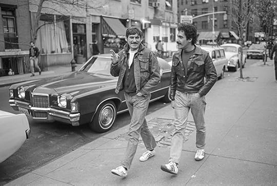Black-and-white photograph of two men walking in New York