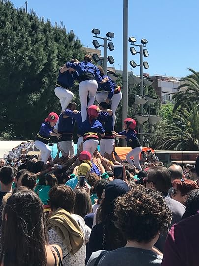 Castelleers climb on top of each other to build a human tower