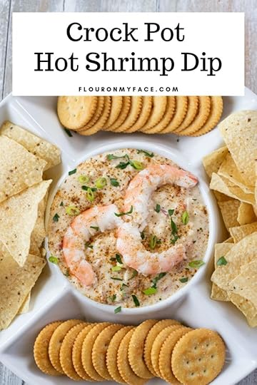 Crock Pot Hot Shrimp Dip recipe served in a sip plate with chips and crackers