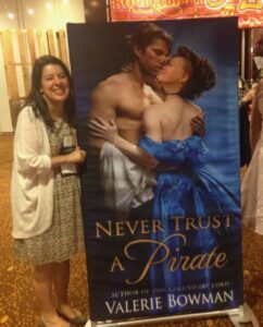 Valerie Bowman with a cutout of her book, Never Trust a Pirate