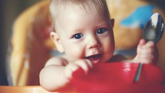 one year old boy eating cookies