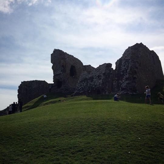 Duffus Castle silhouetted against the sun