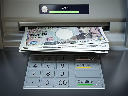Withdrawing Japanese yen notes from an ATM