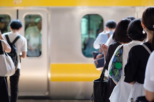 People waiting in line for a train in Tokyo