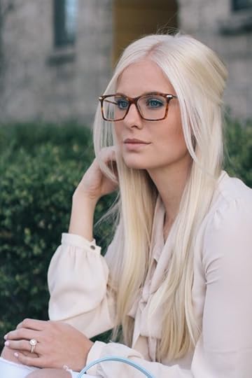 blonde professional woman in glasses