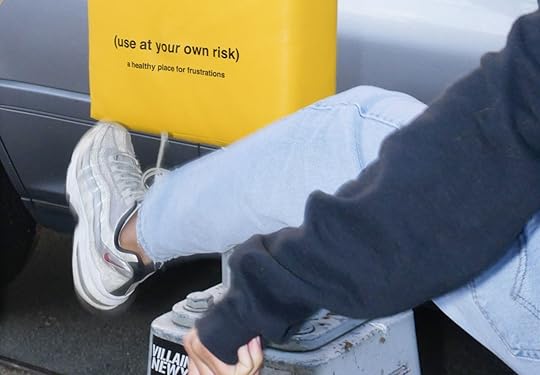 person kicking punching bag