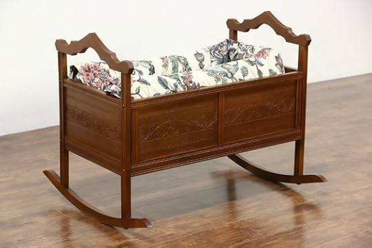 carved country cradle