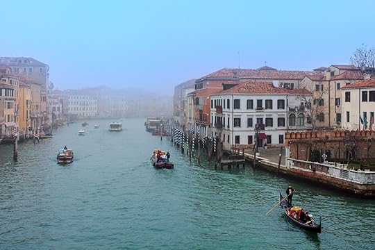 Boats and gondola on misty morning on Grand Canal in Venice