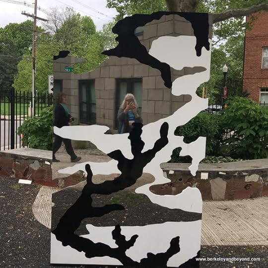 writer reflected in sculpture in garden at Pizzuti Collection of the Columbus Museum of Art in Columbus, Ohio