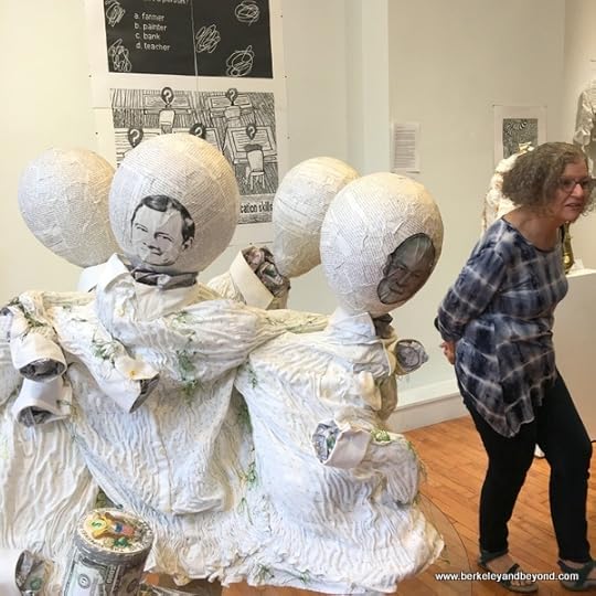 artist Sue Cavanaugh beside her work at (Not) Sheep Art Gallery in Columbus, Ohio