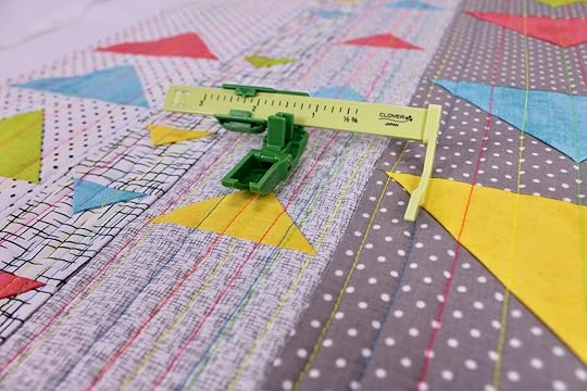 The Ultimate Quilt 'n Stitch Presser Foot by Nancy Zieman for Clover Needlecraft is ideal for straight line machine quilting