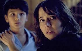 scared woman in darkened room