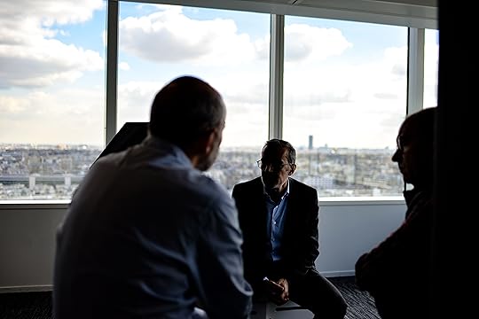 men sitting in circle talking in building