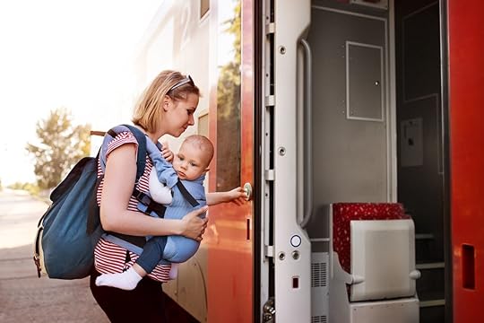 Parent traveling with baby by train