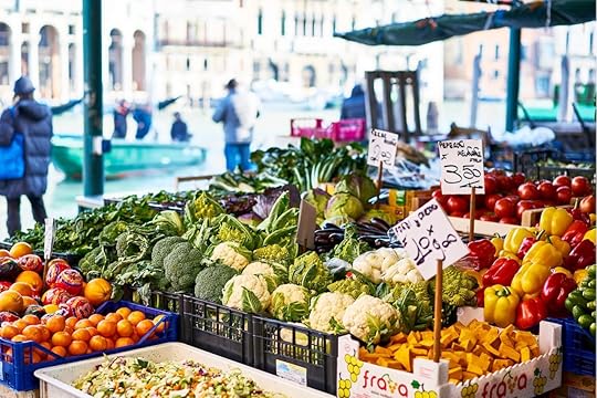 Market stall with vegetables and fruits in Venice Italy with sun Rialto
