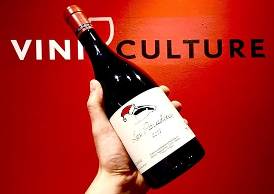 Wine bottle in front of Viniculture sign