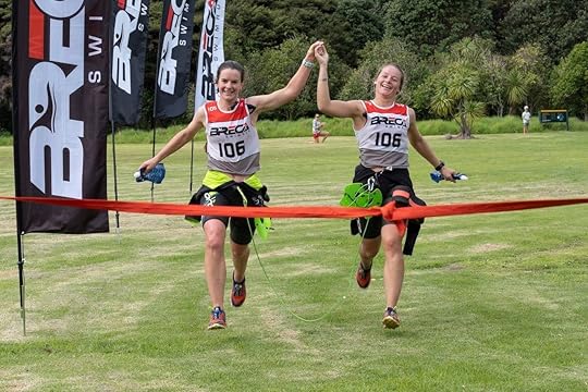 Two people at finish line of Breca Swimrun