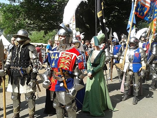 Image may contain: 3 people, people smiling, outdoor