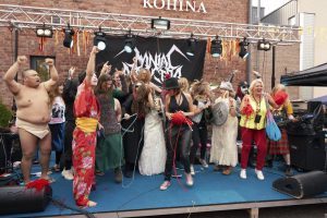 photo of participants of the heavy metal knitting champtionship on stage
