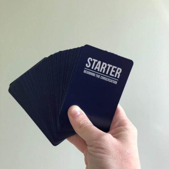 hand holding Q cards