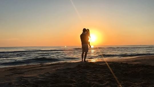 man at the beach with little girl