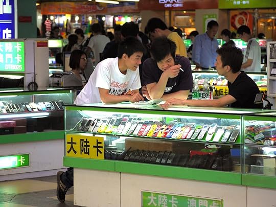 Customers bargaining at counter with a vendor