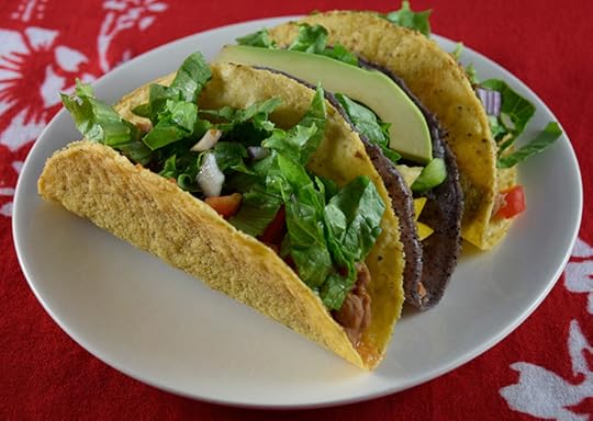 tacos with refried beans, salsa, and veggies
