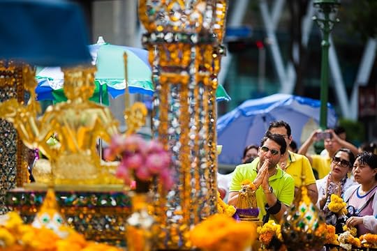 Thai people and tourists pray respect the famous Erawan shrine at Ratchaprasong