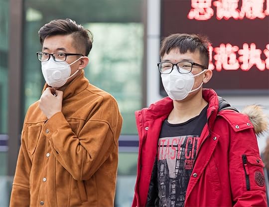 Two people wearing masks
