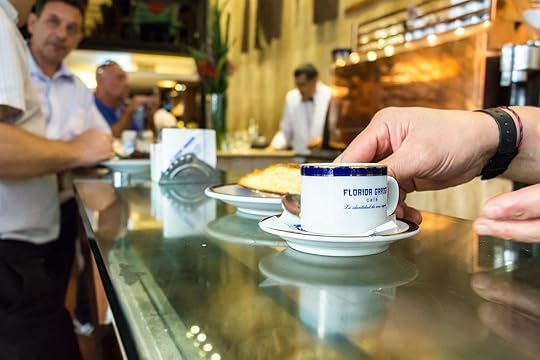 barista serving a cup of espresso coffee called Cortado at the counter of the Florida Garden Cafe, Buenos Aires