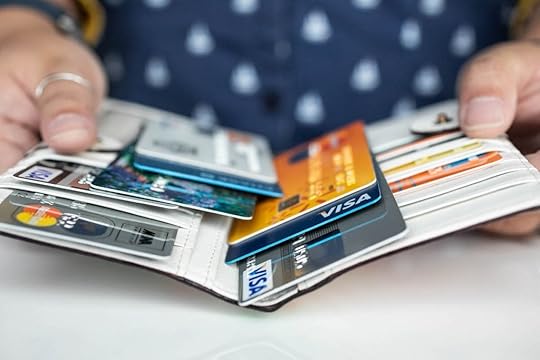 An open wallet showing multiple credit cards.