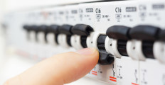 man turning off the fusebox