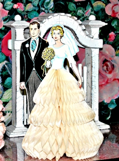 Vintage Bride/Groom. By Jean L. Used under a Creative Commons License. Available at https://www.flickr.com/photos/yourcastlesdecor/14150266866/.