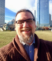 Gregory Sadler in Milwaukee in front of US Bank and Northwestern Mutual Life buildings