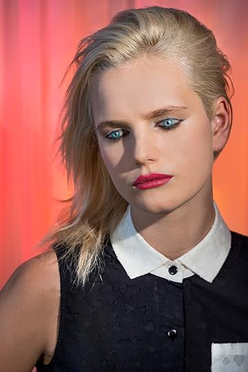 Laurie Simmons How We See/Anmari, portrait of blonde woman against pink and orange background
