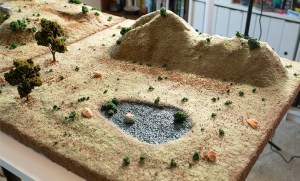 Hill with small pool of water