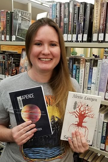 My books, Sapience and Saints & Curses, are on the shelves in my local library! It’s a writer’s dream come true!