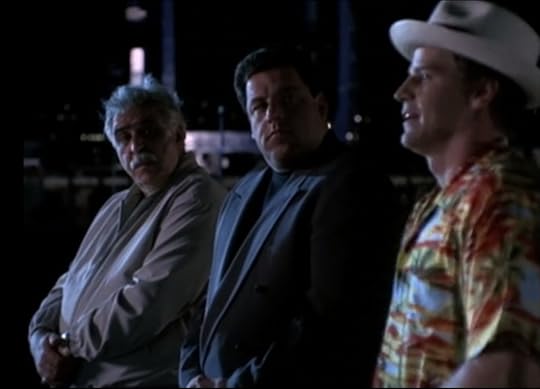 Angel is wearing Doyle's clothes, a stupid fedora and flowered short-sleeve button down.