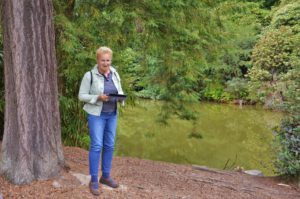 woman standing next to tree