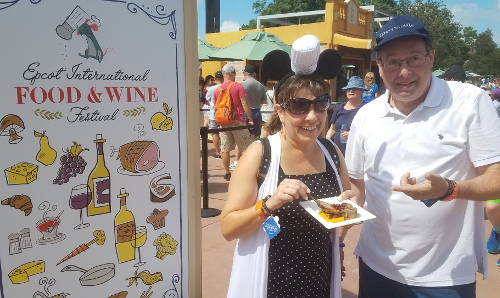 Howard and Kelly enjoying roasted lamb chops in Australia at the Epcot International Food 7 Wine Festival.