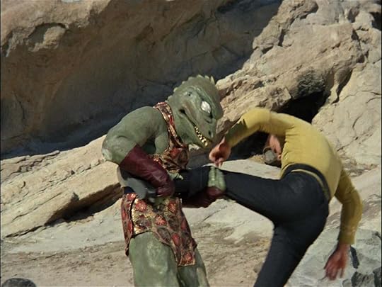 Kirk wrestling a rubber alligator