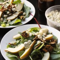 two plates of pear and blue cheese salad