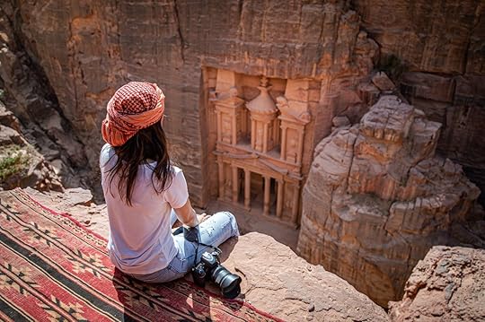 traveler sitting on carpet viewpoint in Petra