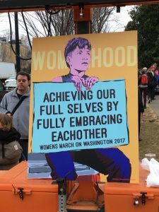 Sign which says Achieving Our Full Selves by Fully Embracing Each Other.